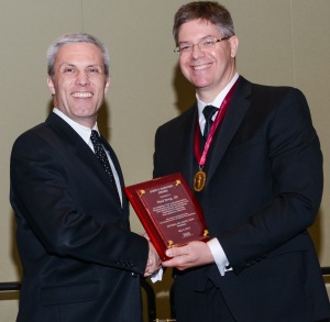 IMS President Jeff Maire, D.O., FACOS, FACS presents  Paul Drey the 2015 John F. Sanford Award